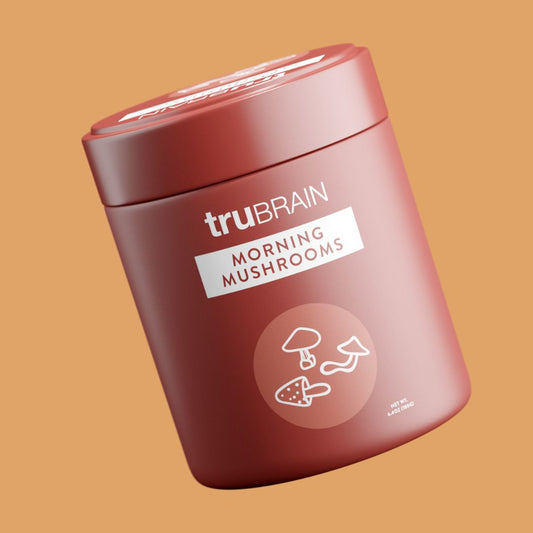 A brown container labeled 'trubrain MORNING MUSHROOMS' with a graphic of mushrooms and a brain, indicating a product related to neuroscience and brain health.